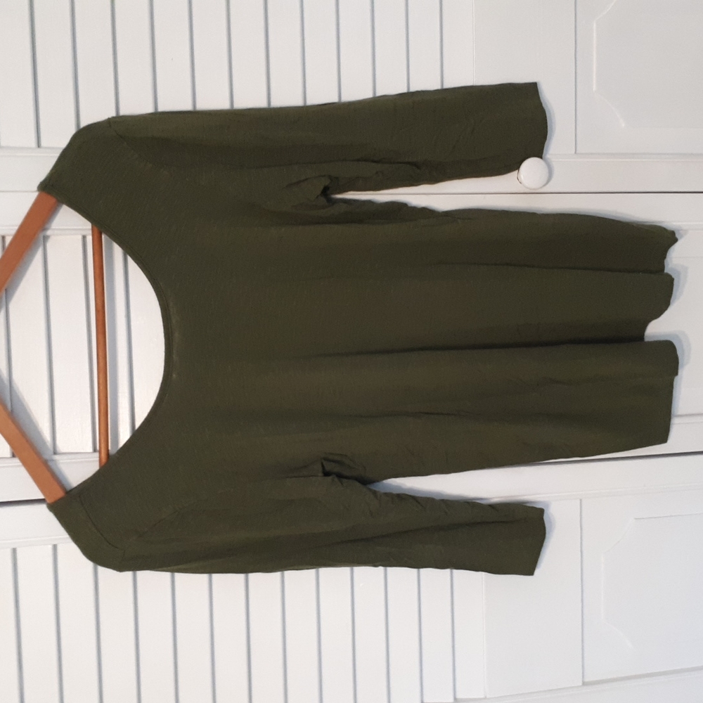 Dolan size L Rayon and spandex. Made in USA